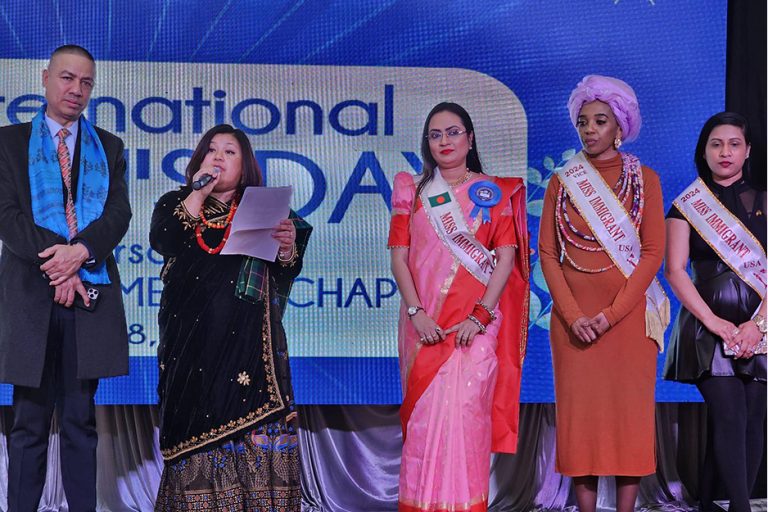 Somnath Ghimire - America Chapter President at GPK Foundation Americas on stage with Miss Immigrant USA Delegates during International Women's Day Celebration